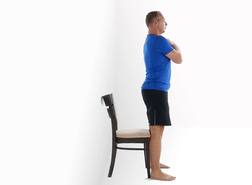 A man sitting to standing